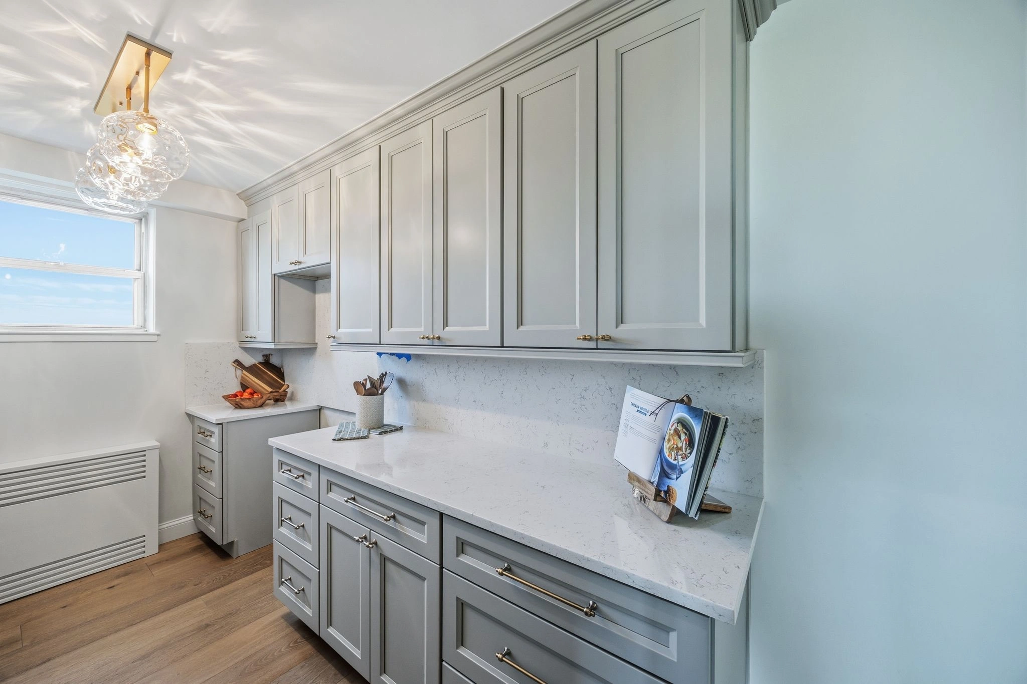 Gray kitchen cabinets done right with smart storage by Keen Improvements